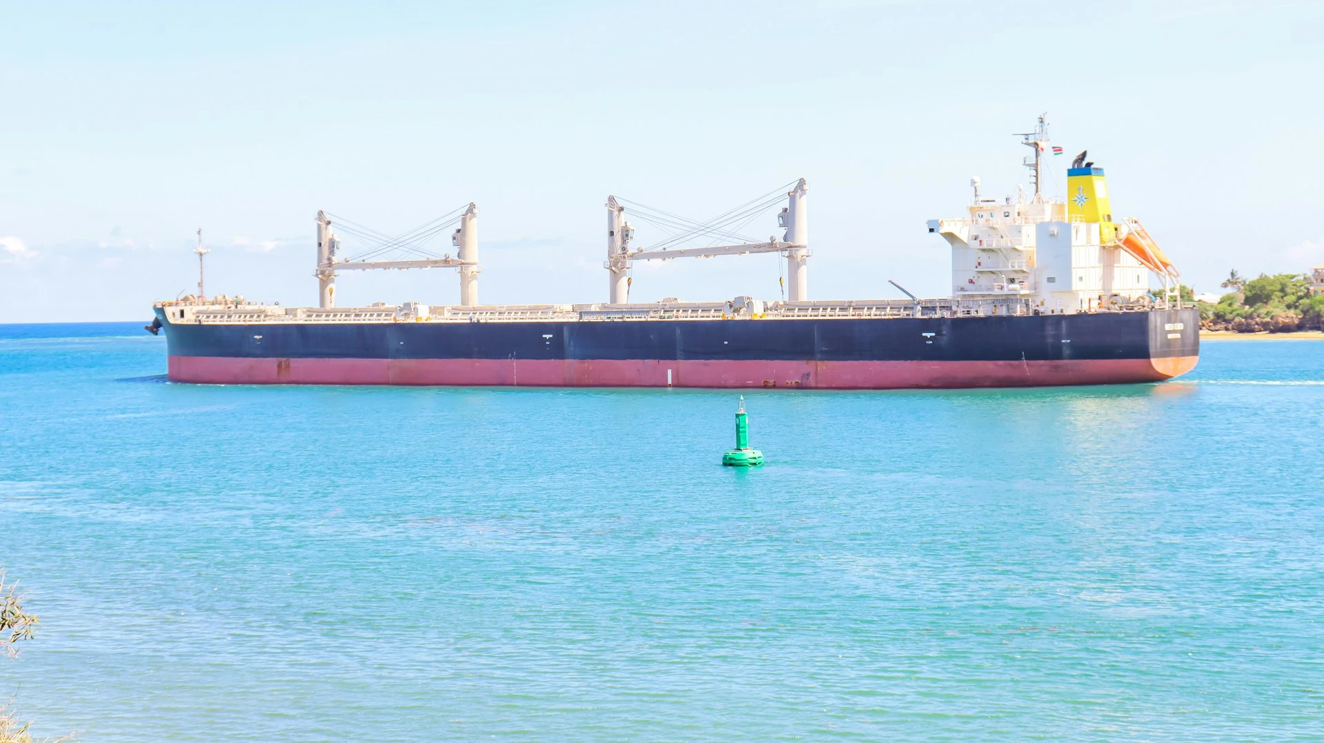Cargo ship carrying containers of used clothing from the USA to Kenya