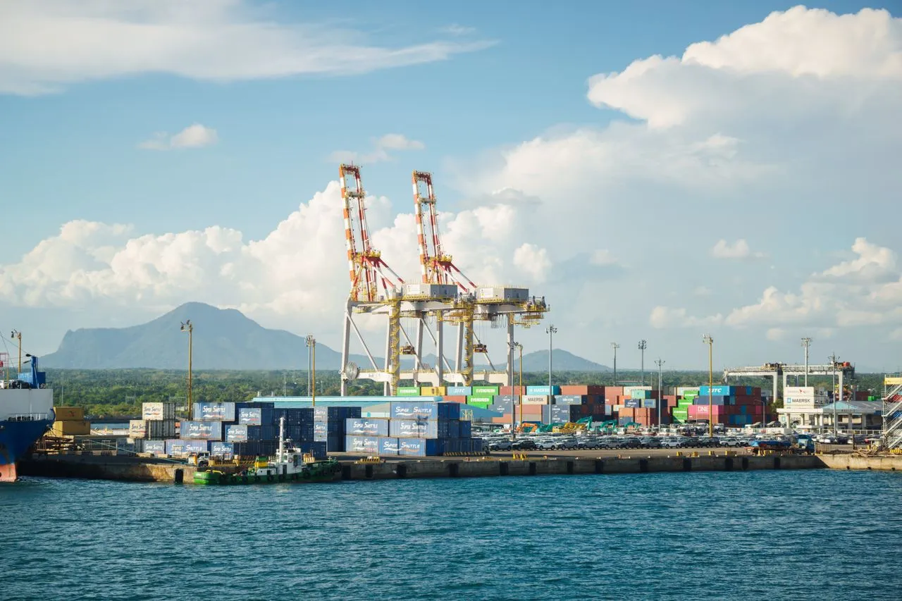Containers and cranes at the port - used clothing import