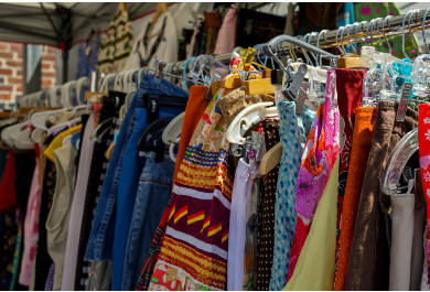 What does quality control of used clothing in a sorting facility involve?